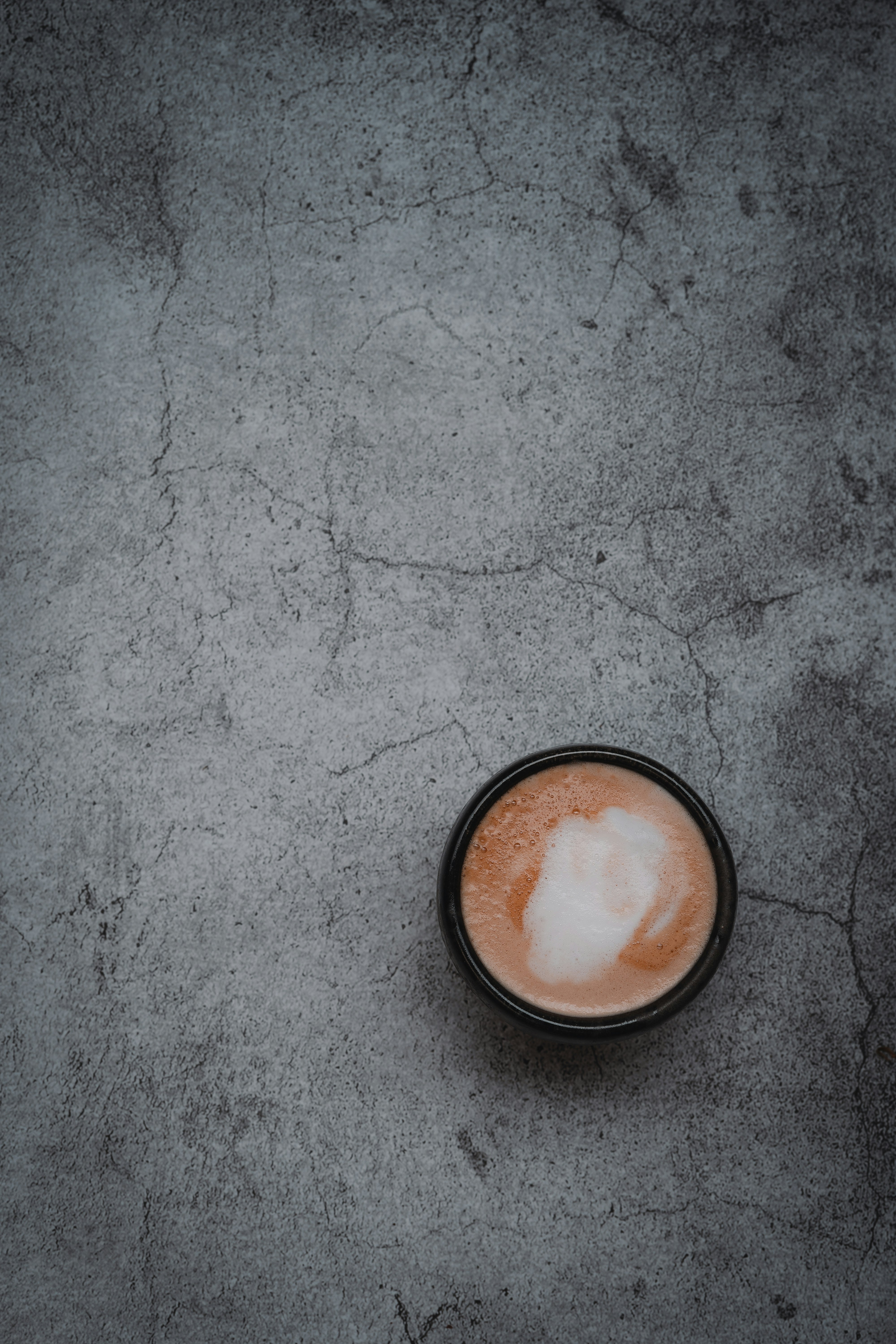 brown round container on gray concrete floor